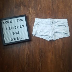 White distressed american eagle shorts